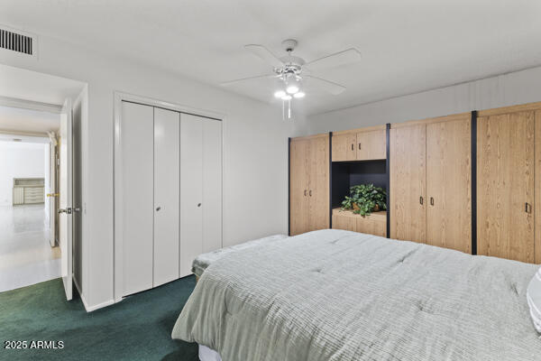 500 West Clarendon Avenue, Unit D6 Phoenix, AZ 85013 - Photo 6 of 23 a bedroom with a large bed and a chandelier