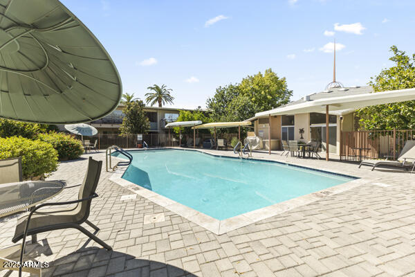 500 West Clarendon Avenue, Unit D6 Phoenix, AZ 85013 - Photo 9 of 23 a view of a swimming pool with a patio
