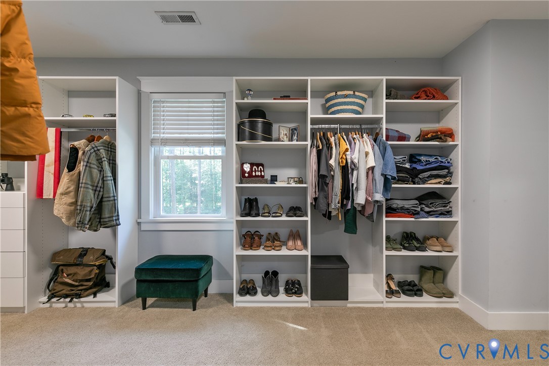 9749 Hoke Brady Road Henrico, VA 23231 - Photo 32 of 53 a view of walk in closet with clothes and shoes