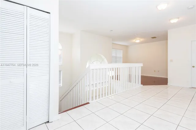 a view of a hallway with windows