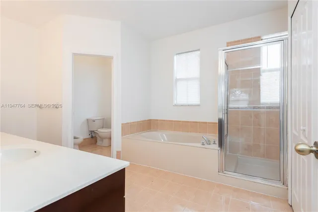 a bathroom with a bathtub and a sink