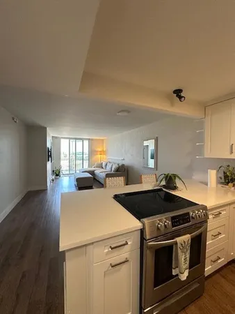 a kitchen with a stove and a refrigerator