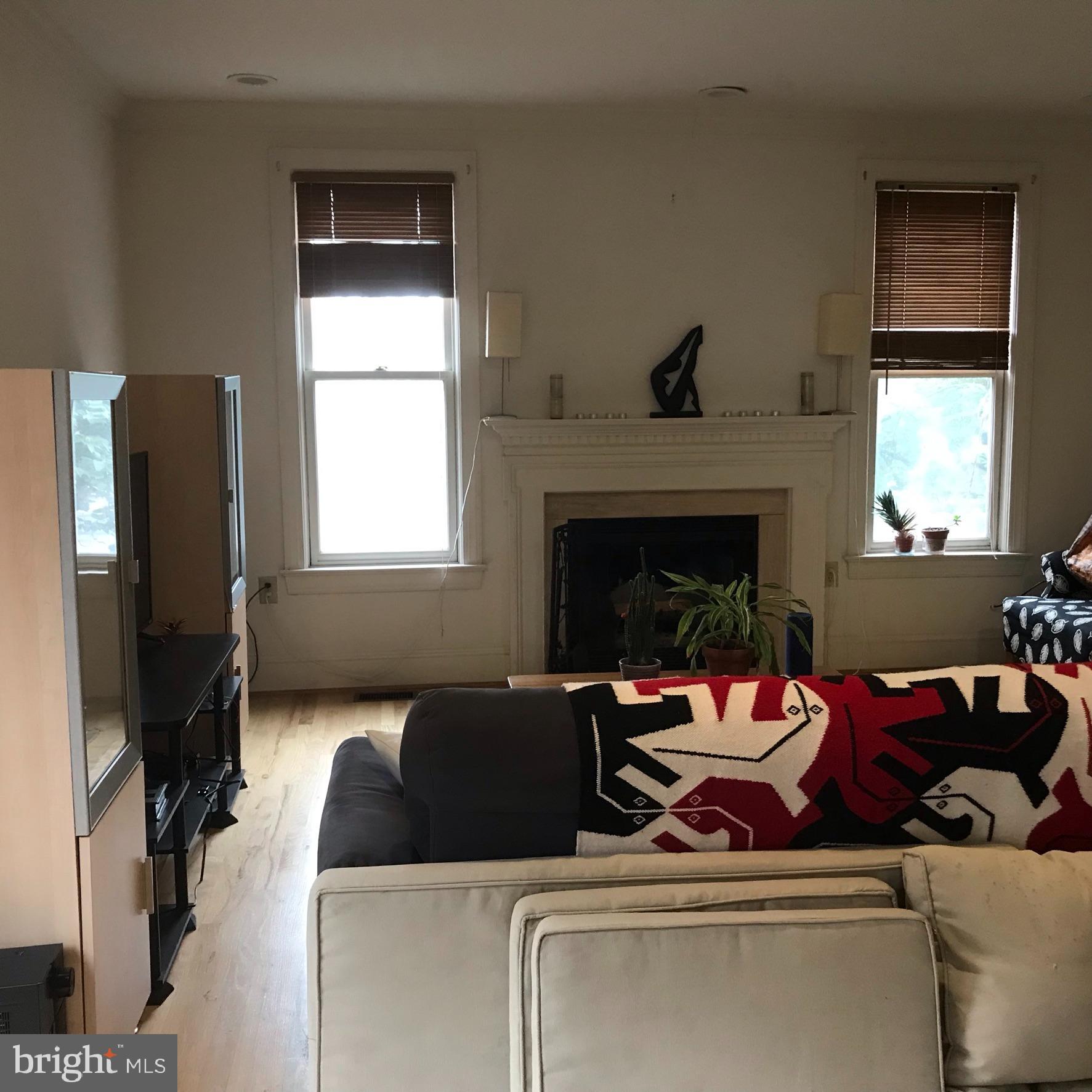 1402 Foxhall Road Northwest Washington, DC 20007 - Photo 5 of 26 Living room with fireplace.