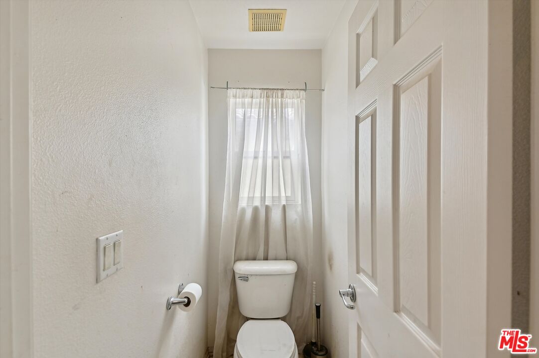 3012 Dunkirk Drive Oxnard, CA 93035 - Photo 15 of 29 a bathroom with a toilet a sink and a shower