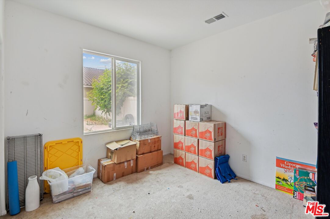 3012 Dunkirk Drive Oxnard, CA 93035 - Photo 22 of 29 a living room with furniture and a book shelf