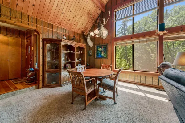 a view of a chairs and table in the patio