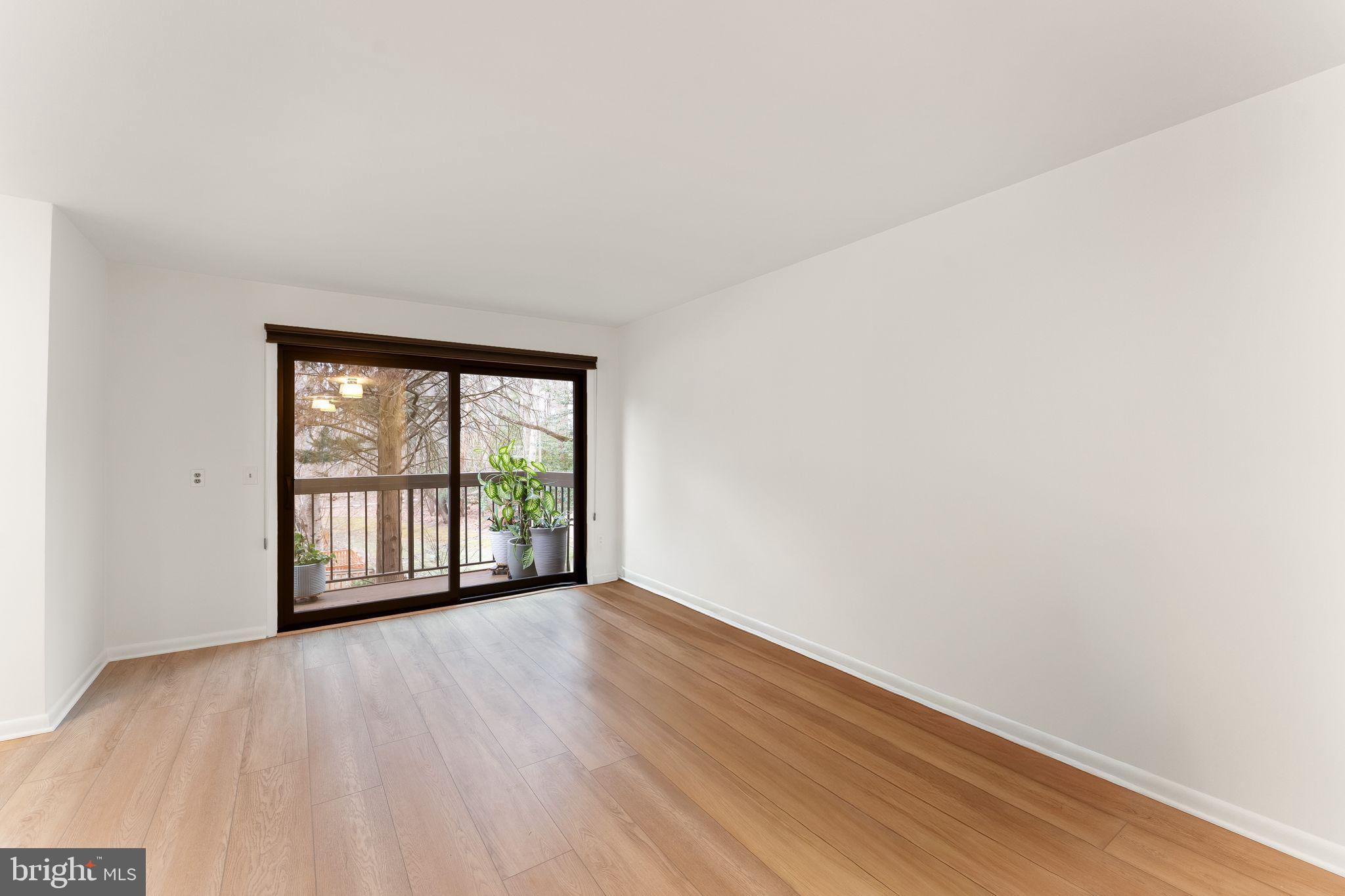 2345 Millennium Lane Reston, VA 20191 - Photo 20 of 55 an empty room with wooden floor and windows