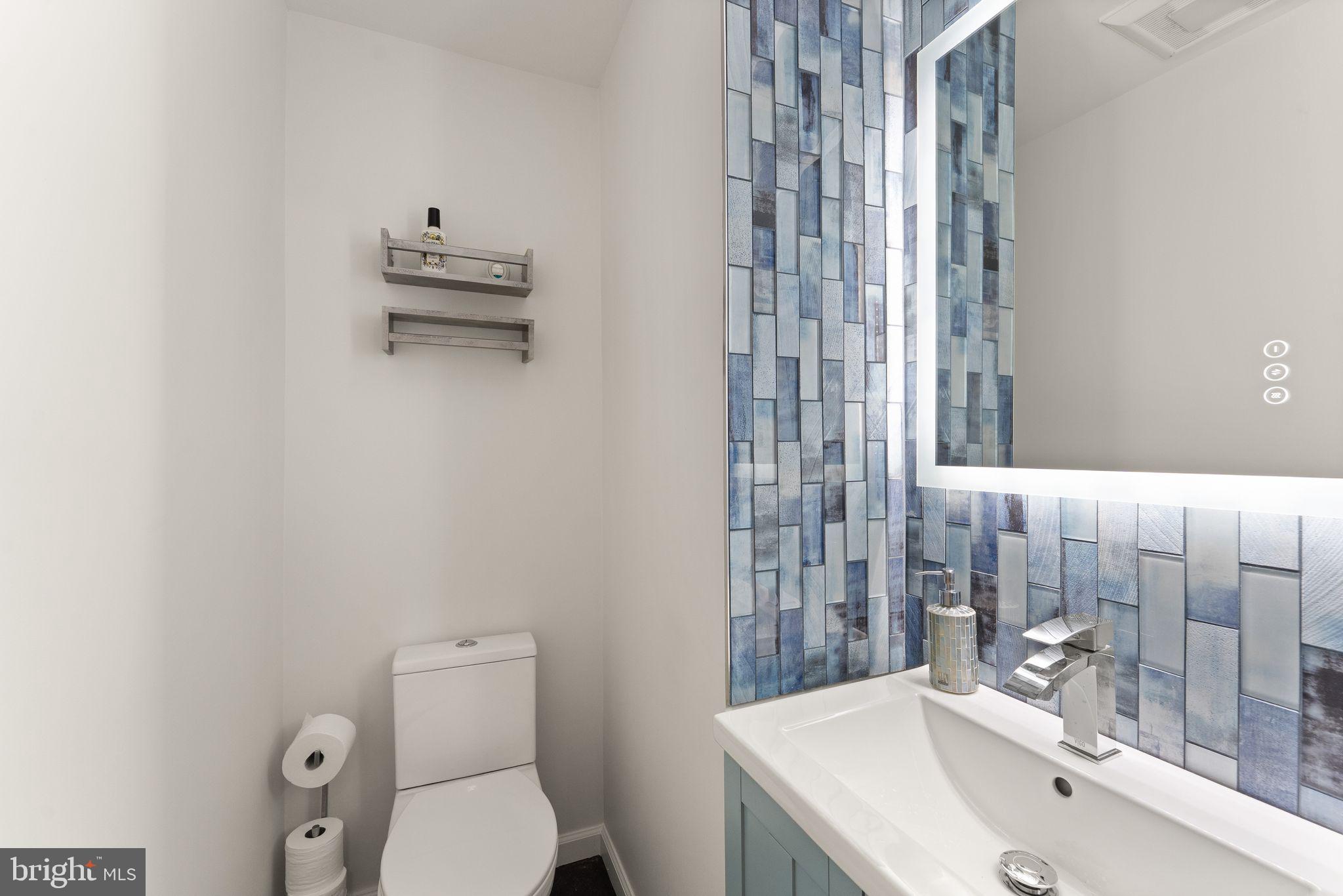2345 Millennium Lane Reston, VA 20191 - Photo 23 of 55 a bathroom with a sink a toilet and shower