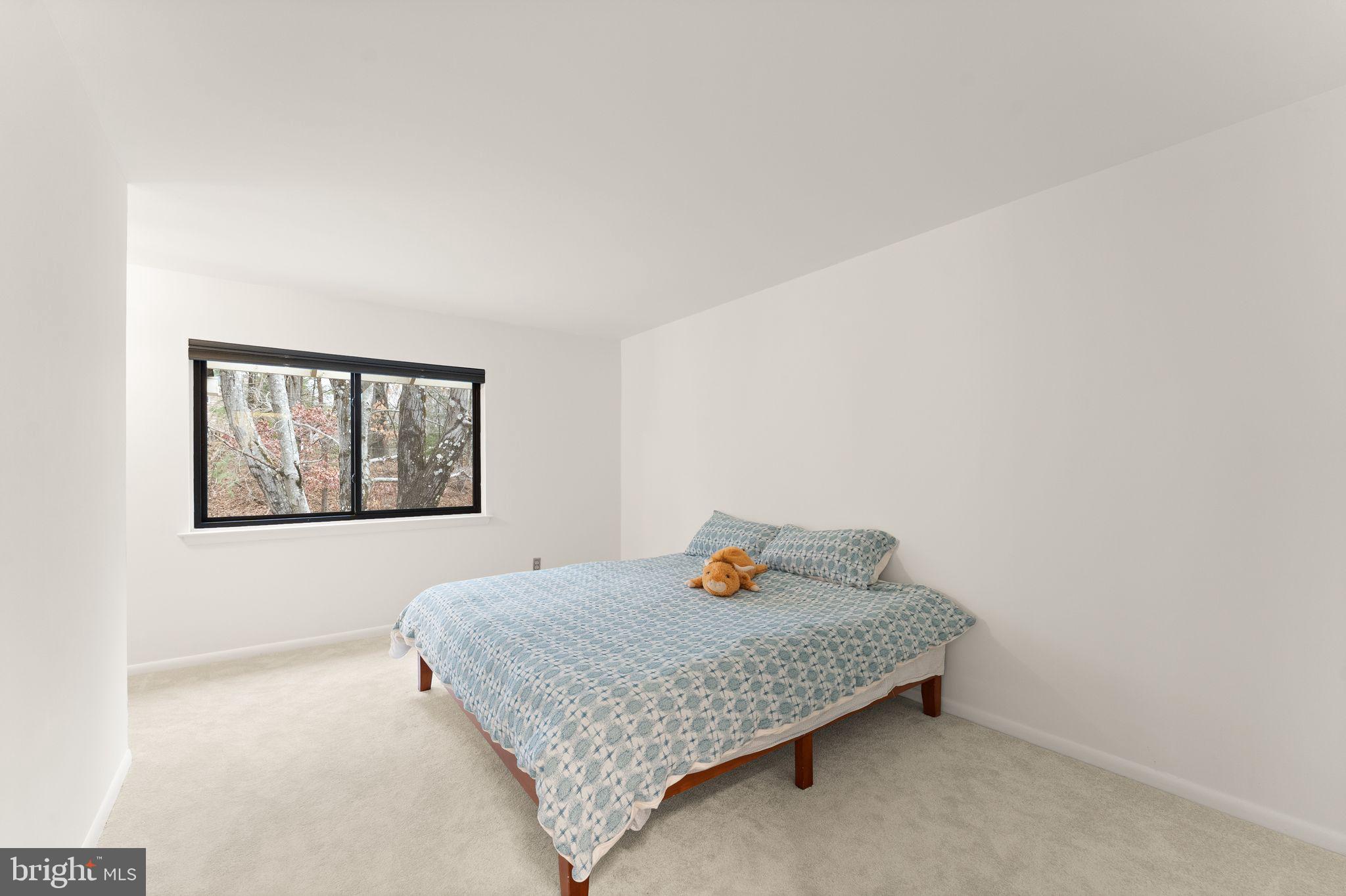 2345 Millennium Lane Reston, VA 20191 - Photo 26 of 55 a bedroom with a bed and window