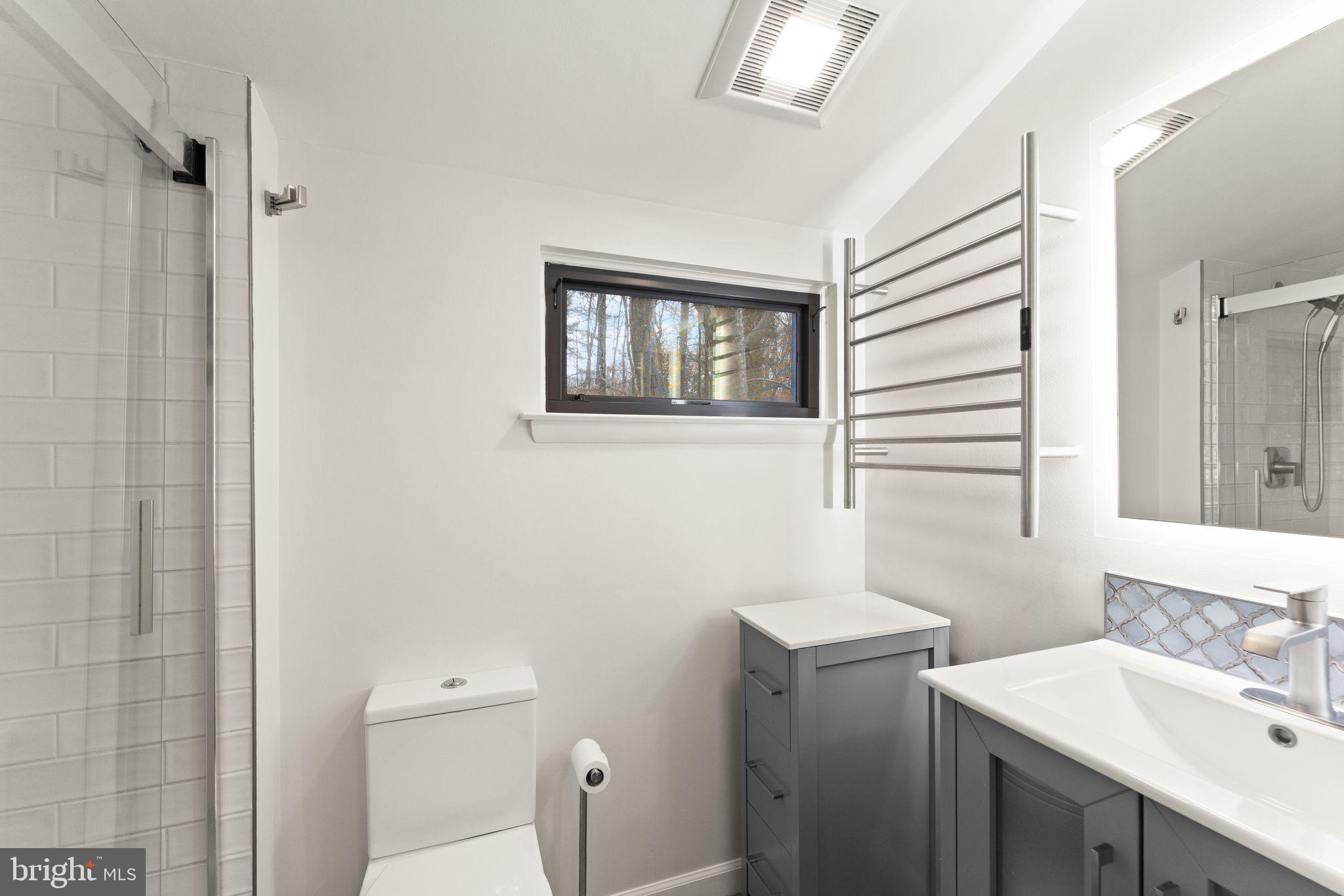 2345 Millennium Lane Reston, VA 20191 - Photo 30 of 55 a bathroom with a sink vanity and a toilet