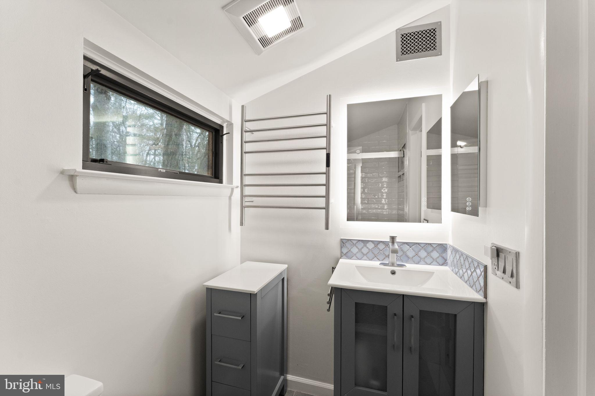 2345 Millennium Lane Reston, VA 20191 - Photo 32 of 55 a bathroom with a sink and a mirror