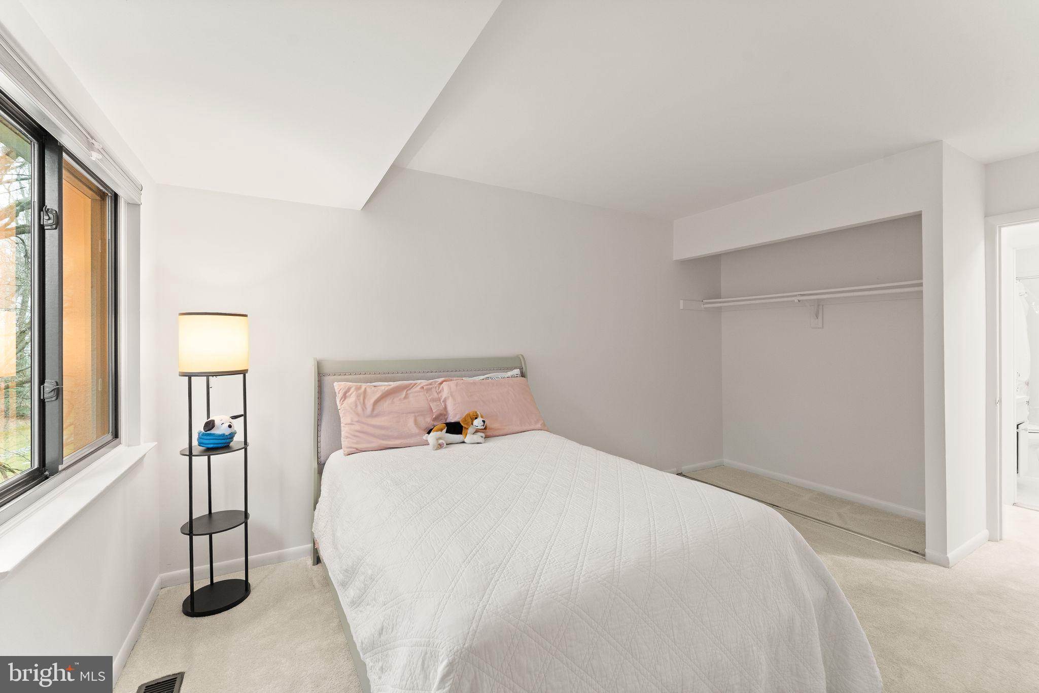 2345 Millennium Lane Reston, VA 20191 - Photo 35 of 55 a bedroom with a bed and a window