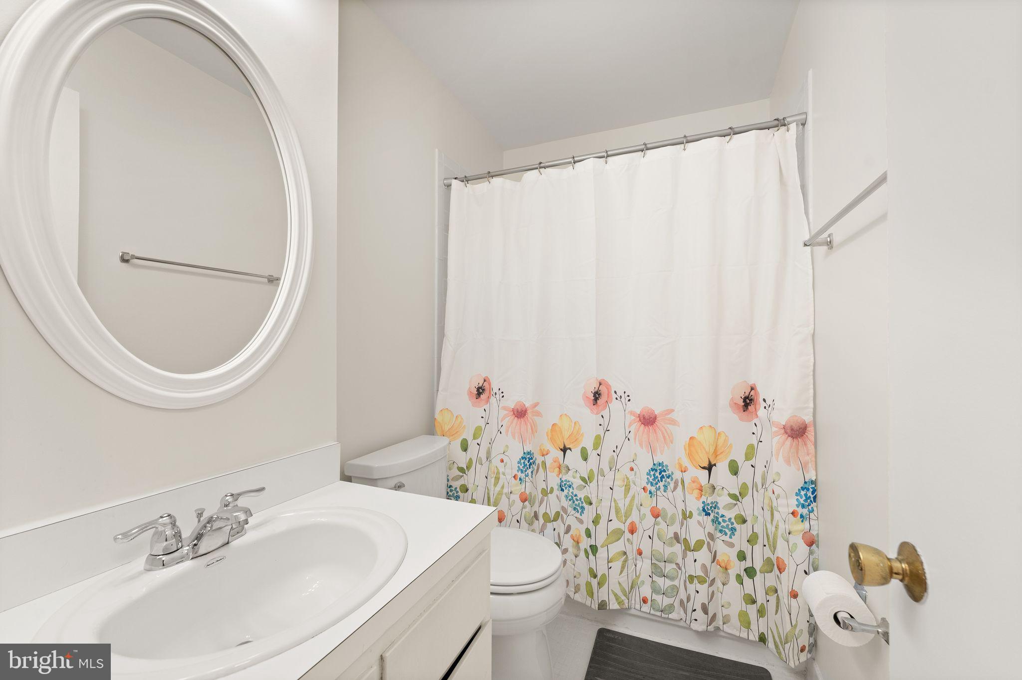 2345 Millennium Lane Reston, VA 20191 - Photo 37 of 55 a bathroom with a sink toilet and a mirror