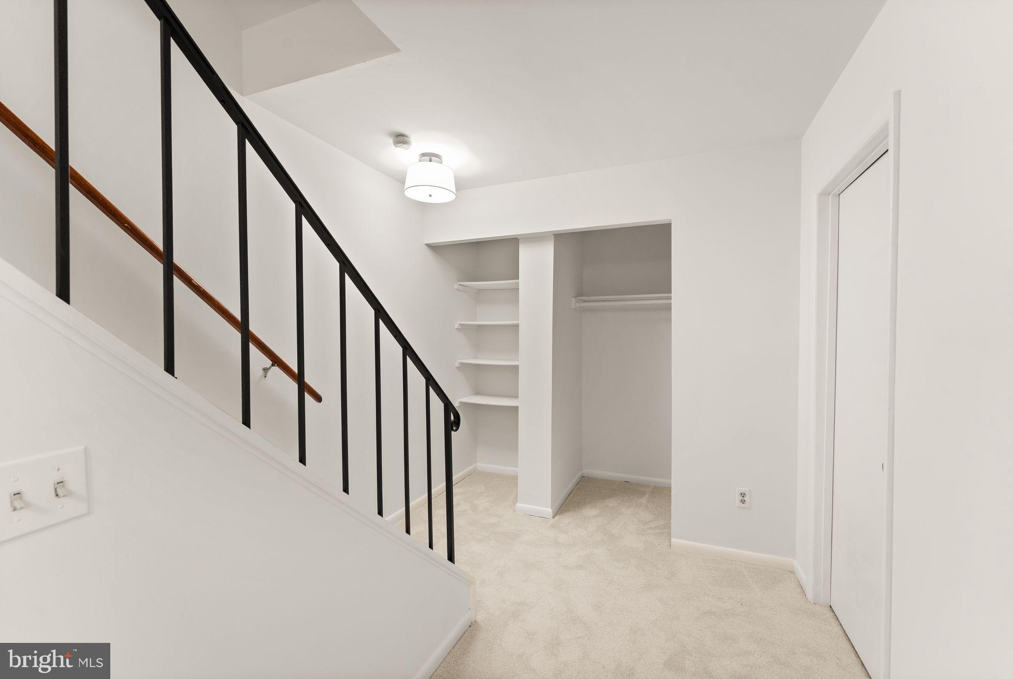 2345 Millennium Lane Reston, VA 20191 - Photo 38 of 55 a view of staircase with wooden floor and white walls