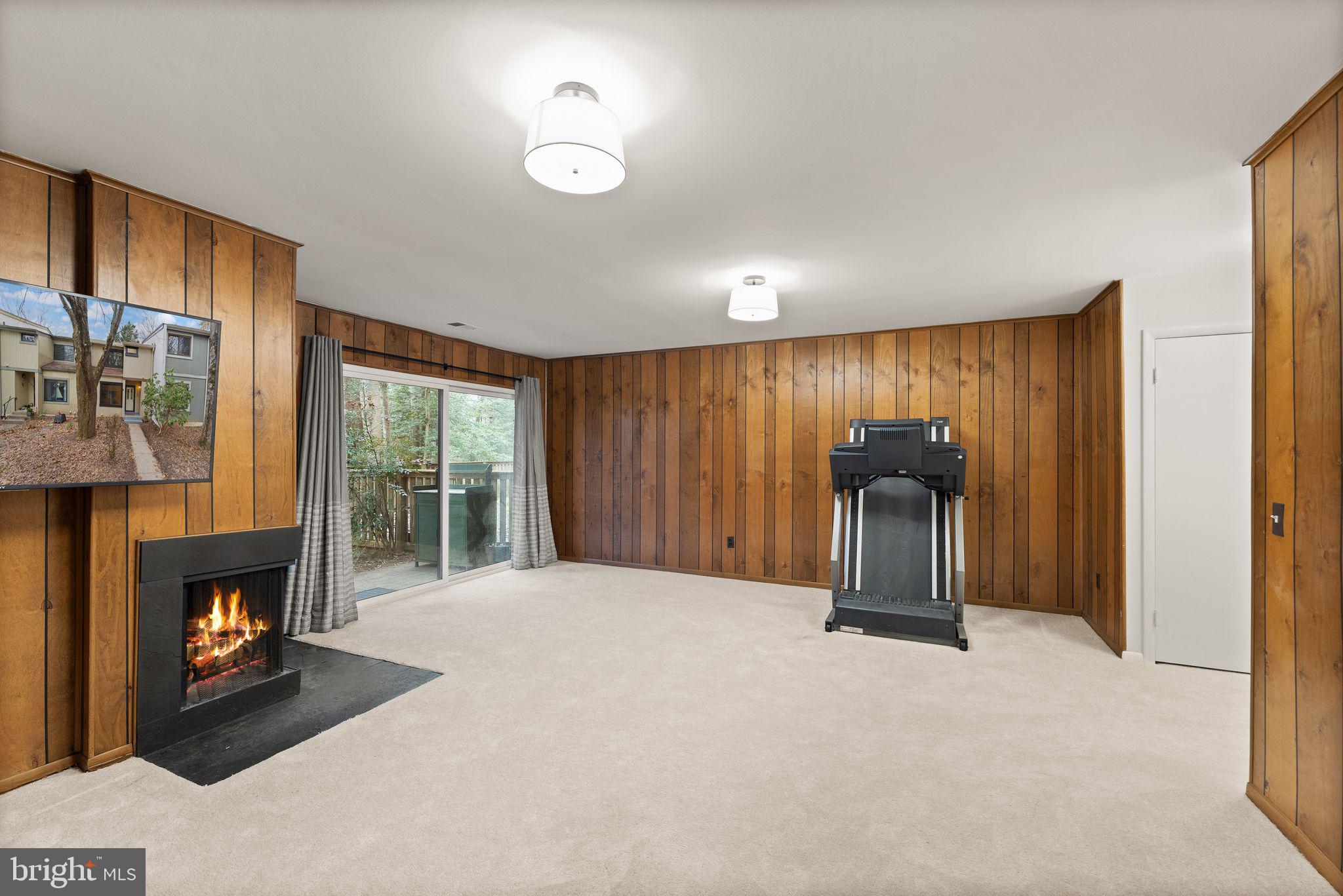 2345 Millennium Lane Reston, VA 20191 - Photo 43 of 55 a view of an empty room with a fireplace and a window