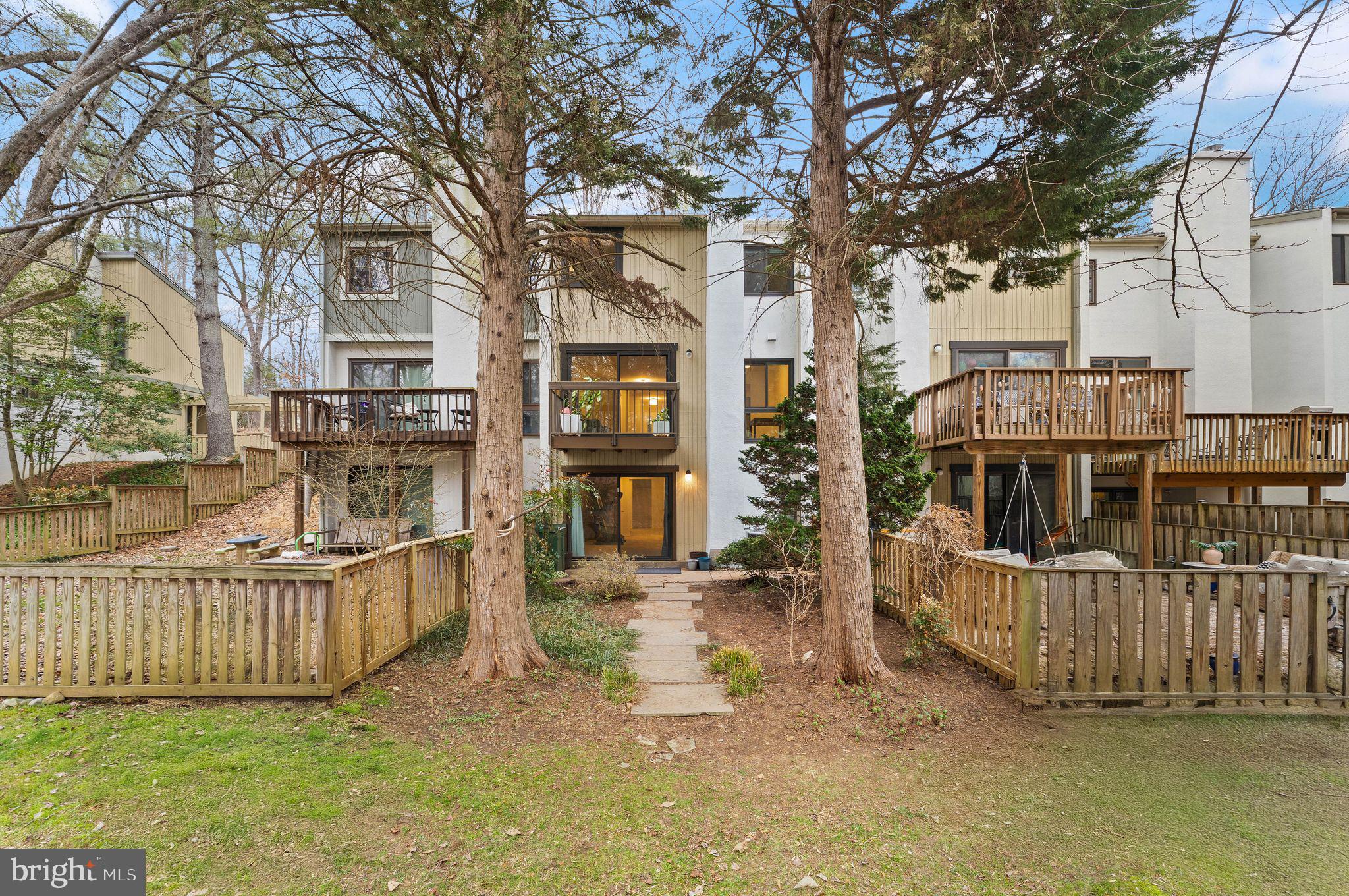 2345 Millennium Lane Reston, VA 20191 - Photo 48 of 55 front view of a house with a large window and wooden fence