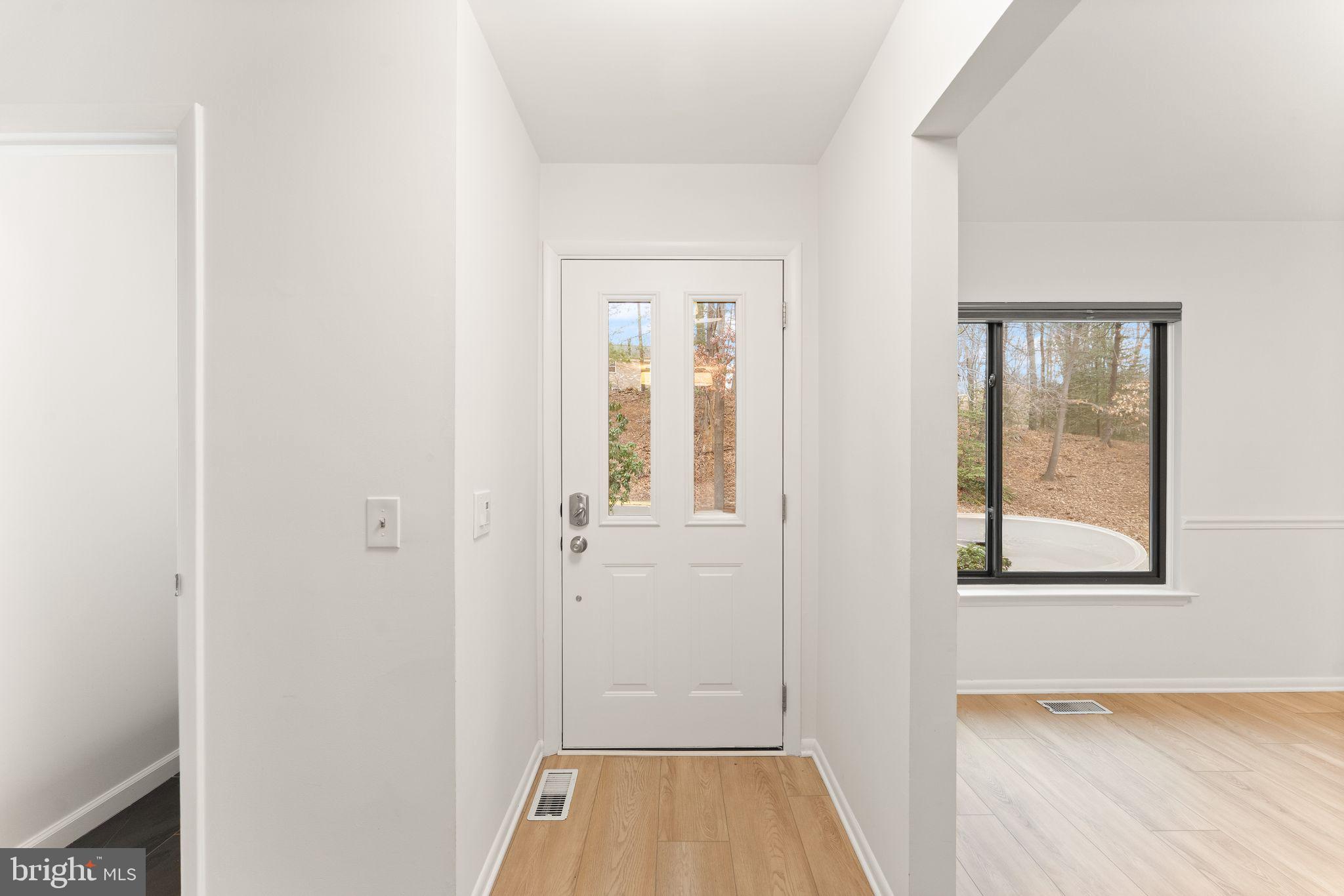 2345 Millennium Lane Reston, VA 20191 - Photo 8 of 55 a view of an empty room with closet and a window