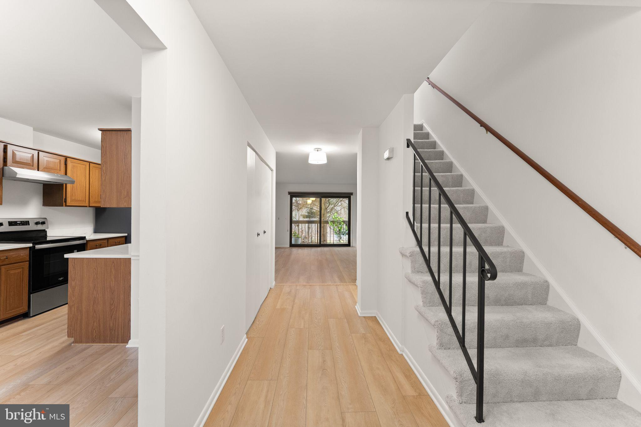 2345 Millennium Lane Reston, VA 20191 - Photo 9 of 55 a view of a kitchen with wooden floor and stairs