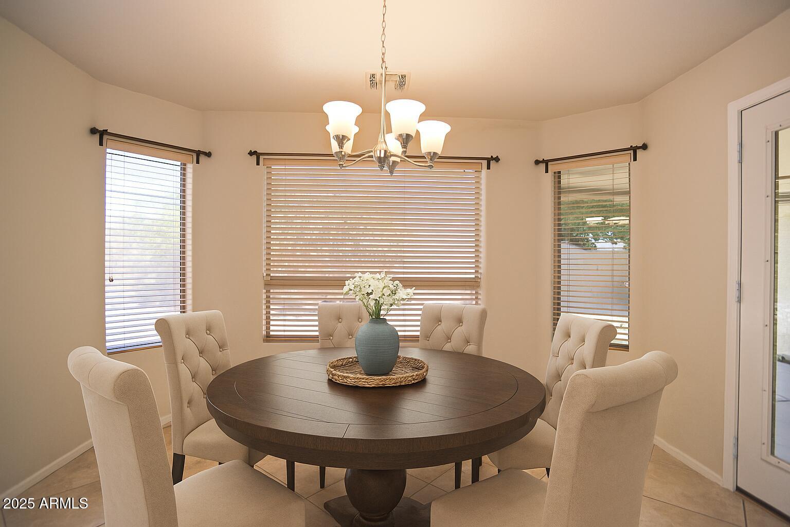 4953 South Moss Drive Chandler, AZ 85248 - Photo 21 of 50 a dining room with furniture and window