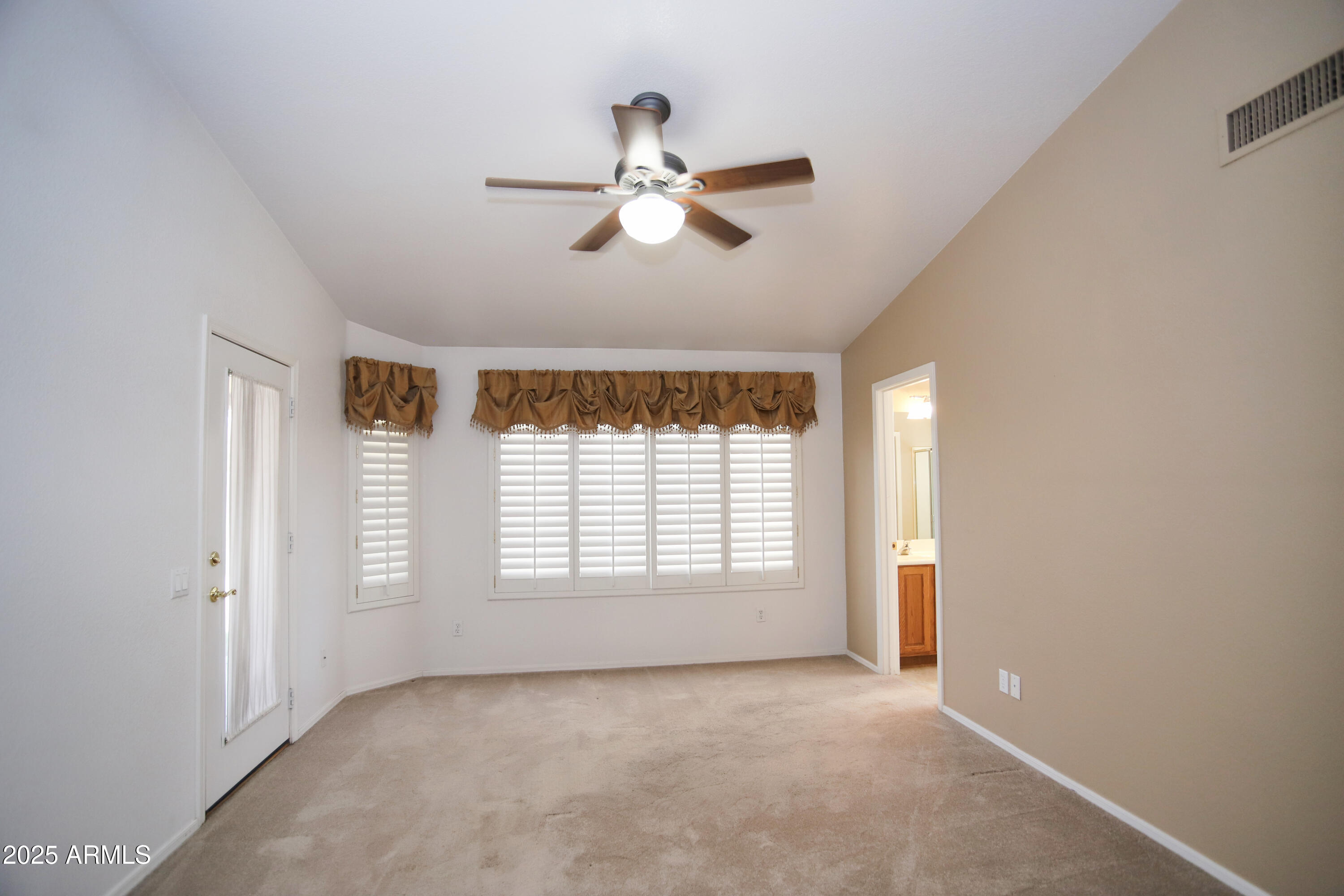 4953 South Moss Drive Chandler, AZ 85248 - Photo 22 of 50 a view of empty room with windows and chandelier fan