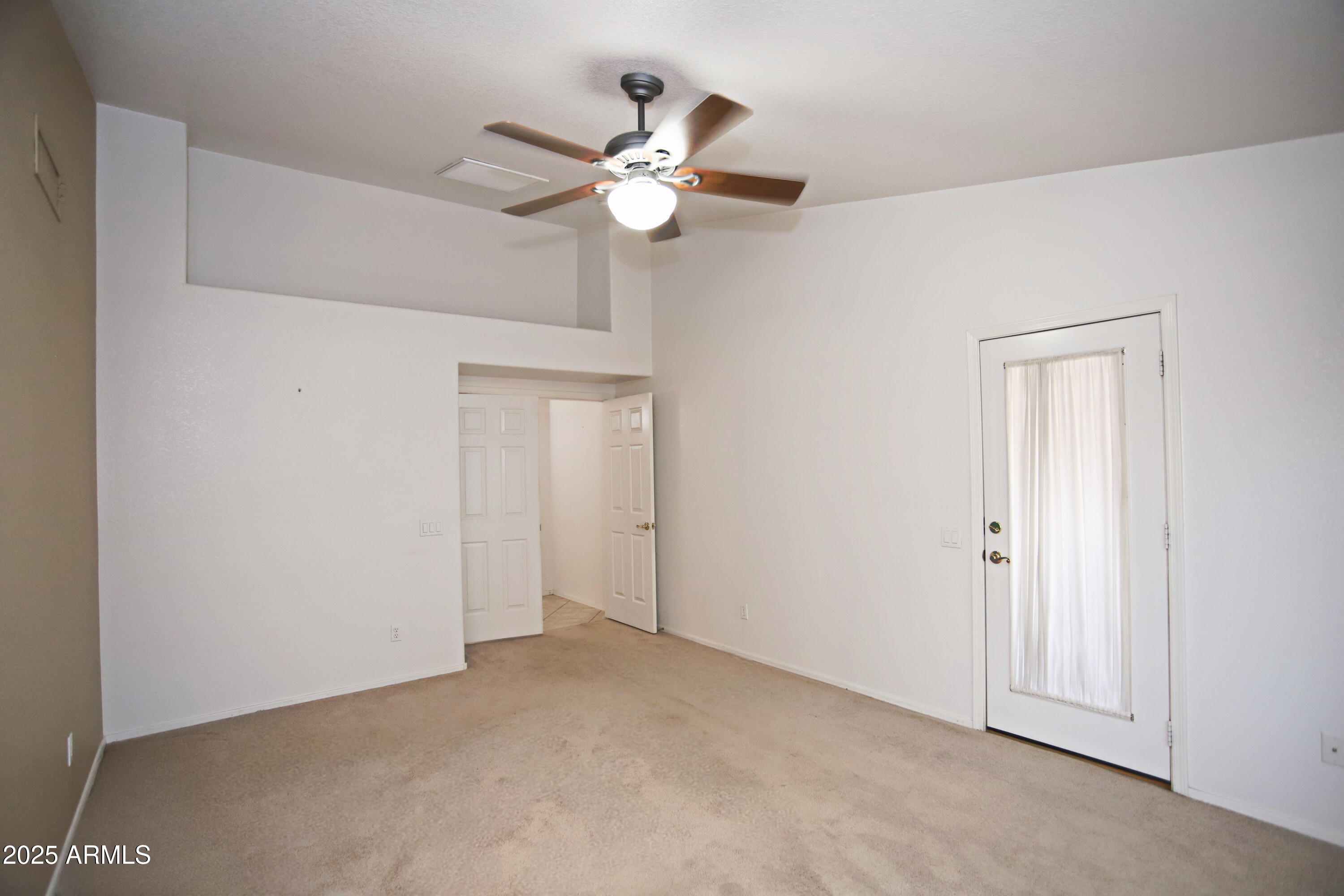 4953 South Moss Drive Chandler, AZ 85248 - Photo 24 of 50 a view of an empty room with a chandelier fan