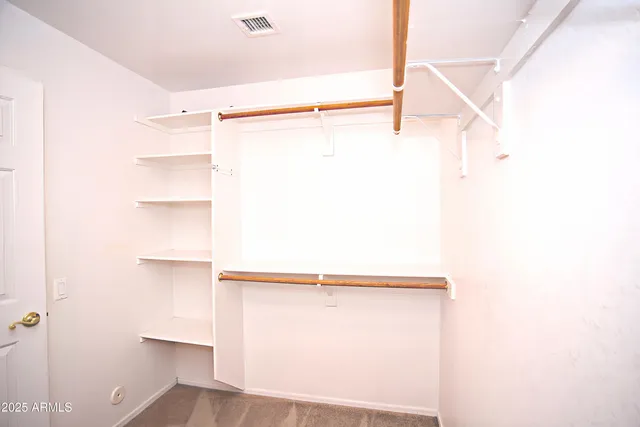 a view of a room with racks on the wall