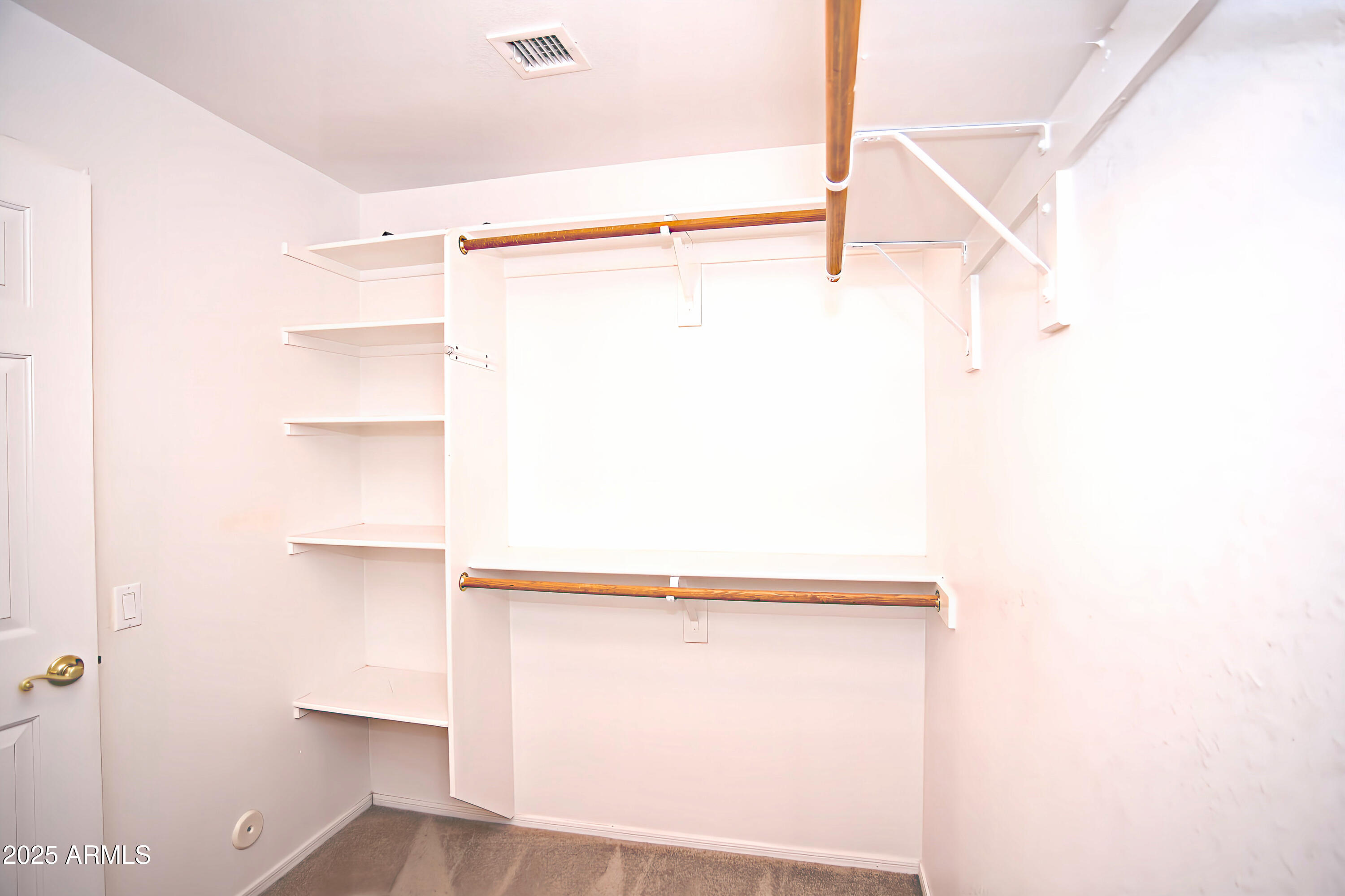 4953 South Moss Drive Chandler, AZ 85248 - Photo 29 of 50 a view of a room with racks on the wall