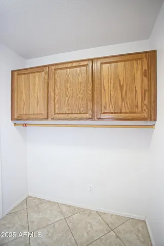 an empty room with windows and entrance