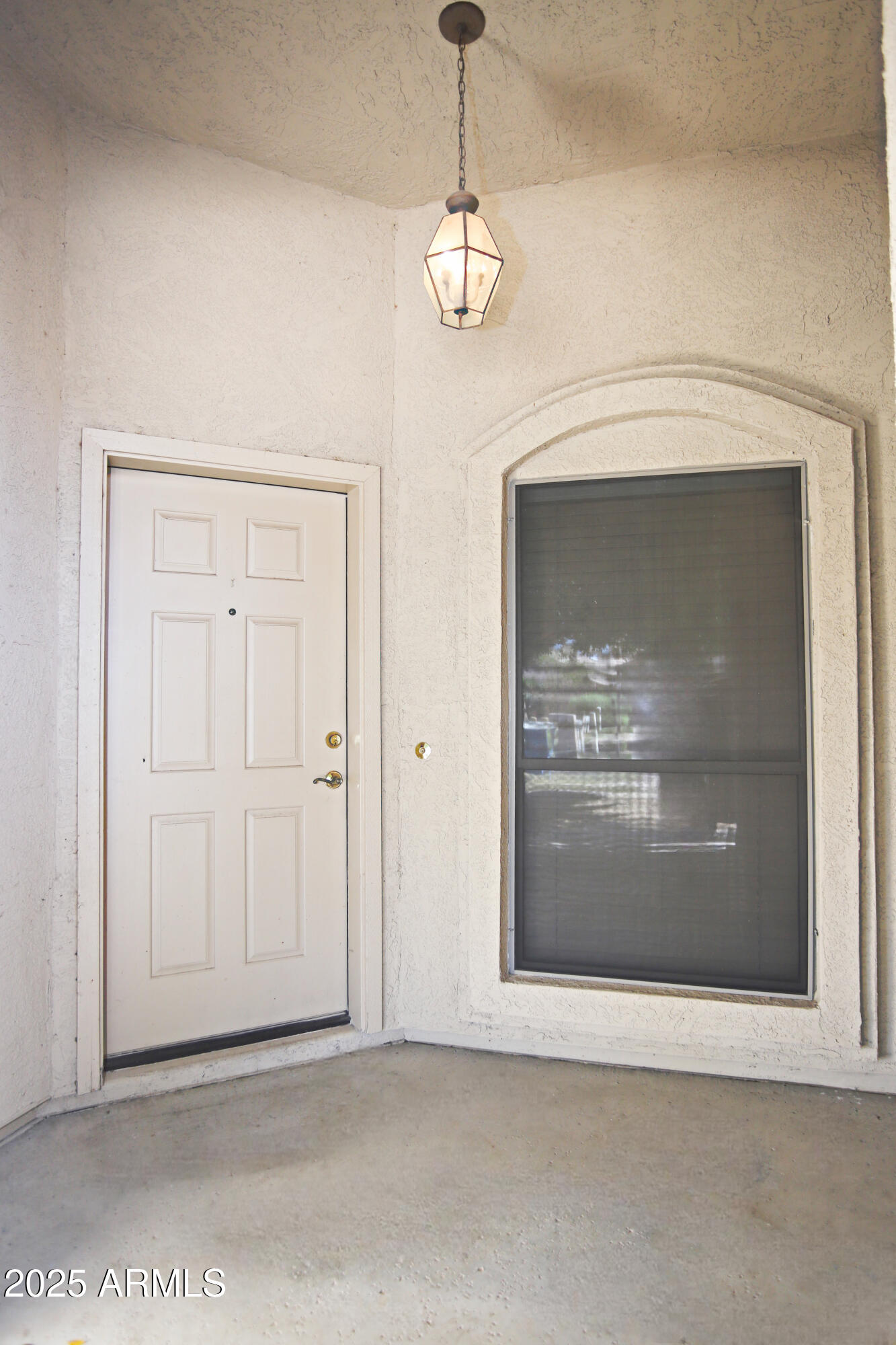 4953 South Moss Drive Chandler, AZ 85248 - Photo 4 of 50 a view of a hallway with a chandelier