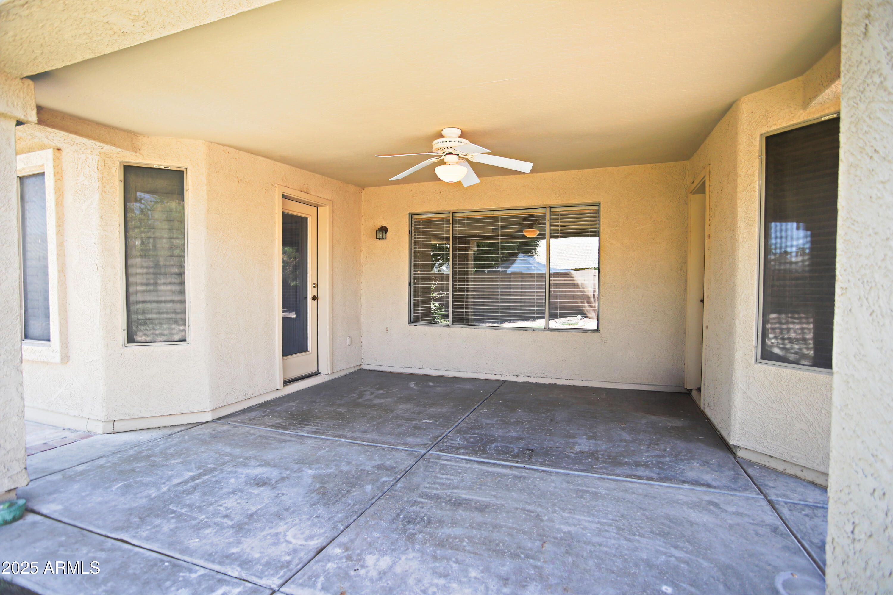 4953 South Moss Drive Chandler, AZ 85248 - Photo 41 of 50 an empty room with windows and entrance