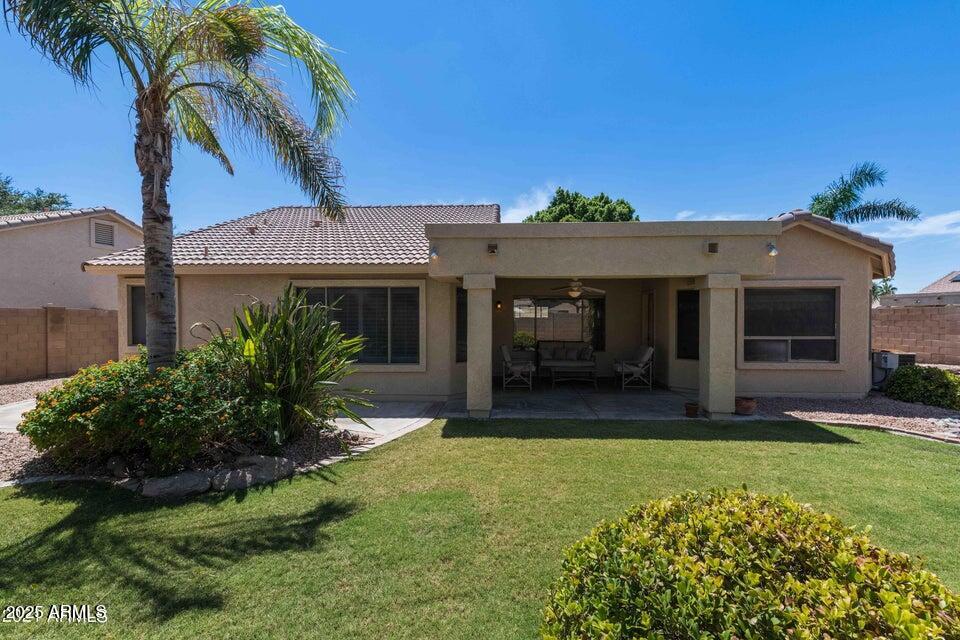 4953 South Moss Drive Chandler, AZ 85248 - Photo 42 of 50 a front view of a house with a garden