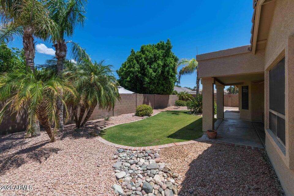 4953 South Moss Drive Chandler, AZ 85248 - Photo 44 of 50 a view of a house with a yard