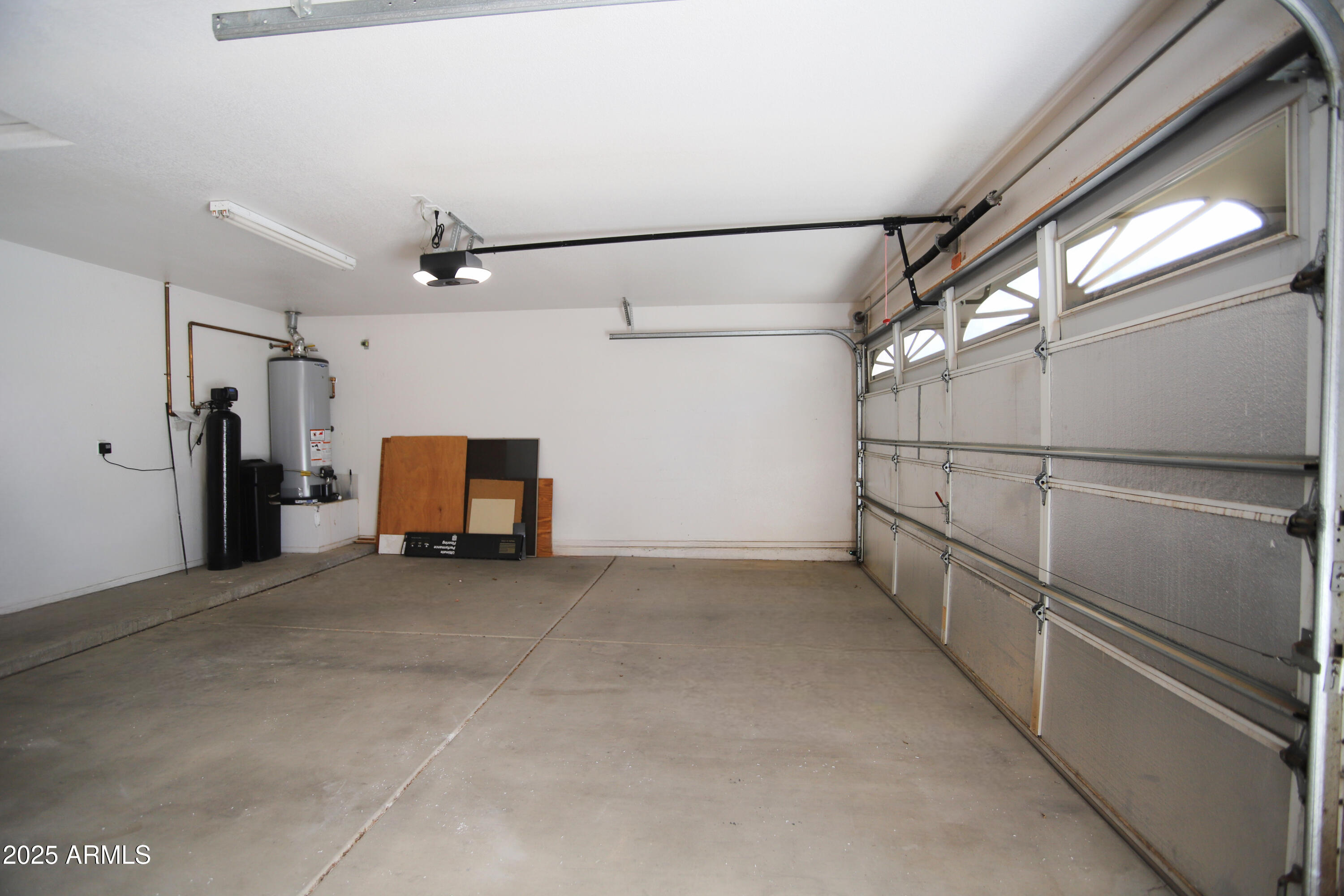 4953 South Moss Drive Chandler, AZ 85248 - Photo 45 of 50 a view of a hallway with a refrigerator