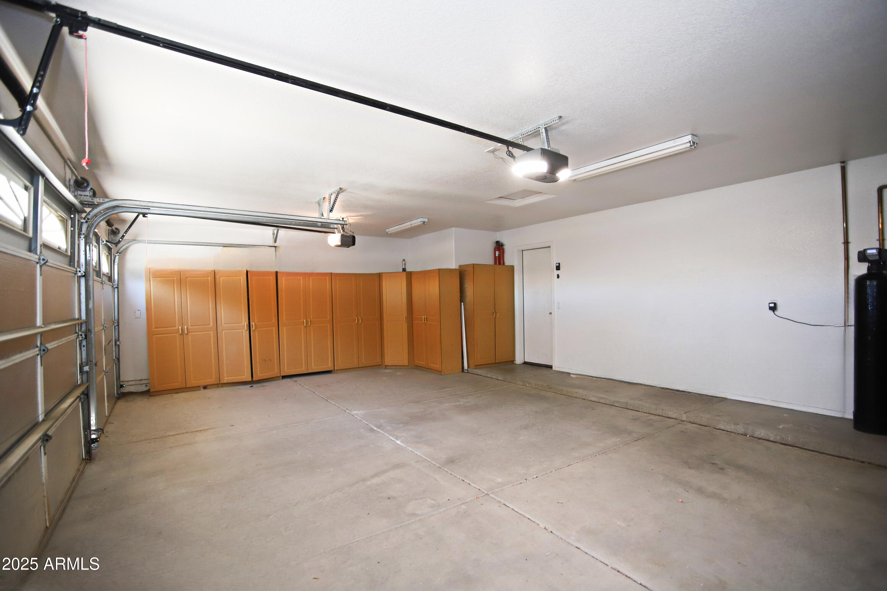 4953 South Moss Drive Chandler, AZ 85248 - Photo 46 of 50 an empty room with windows & cabinet