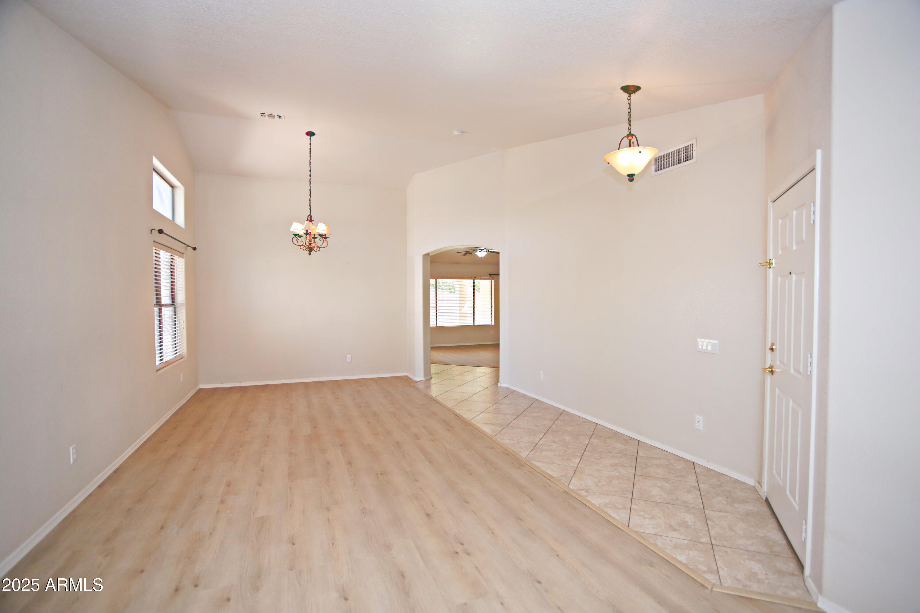 4953 South Moss Drive Chandler, AZ 85248 - Photo 7 of 50 an empty room with windows and ceiling fan