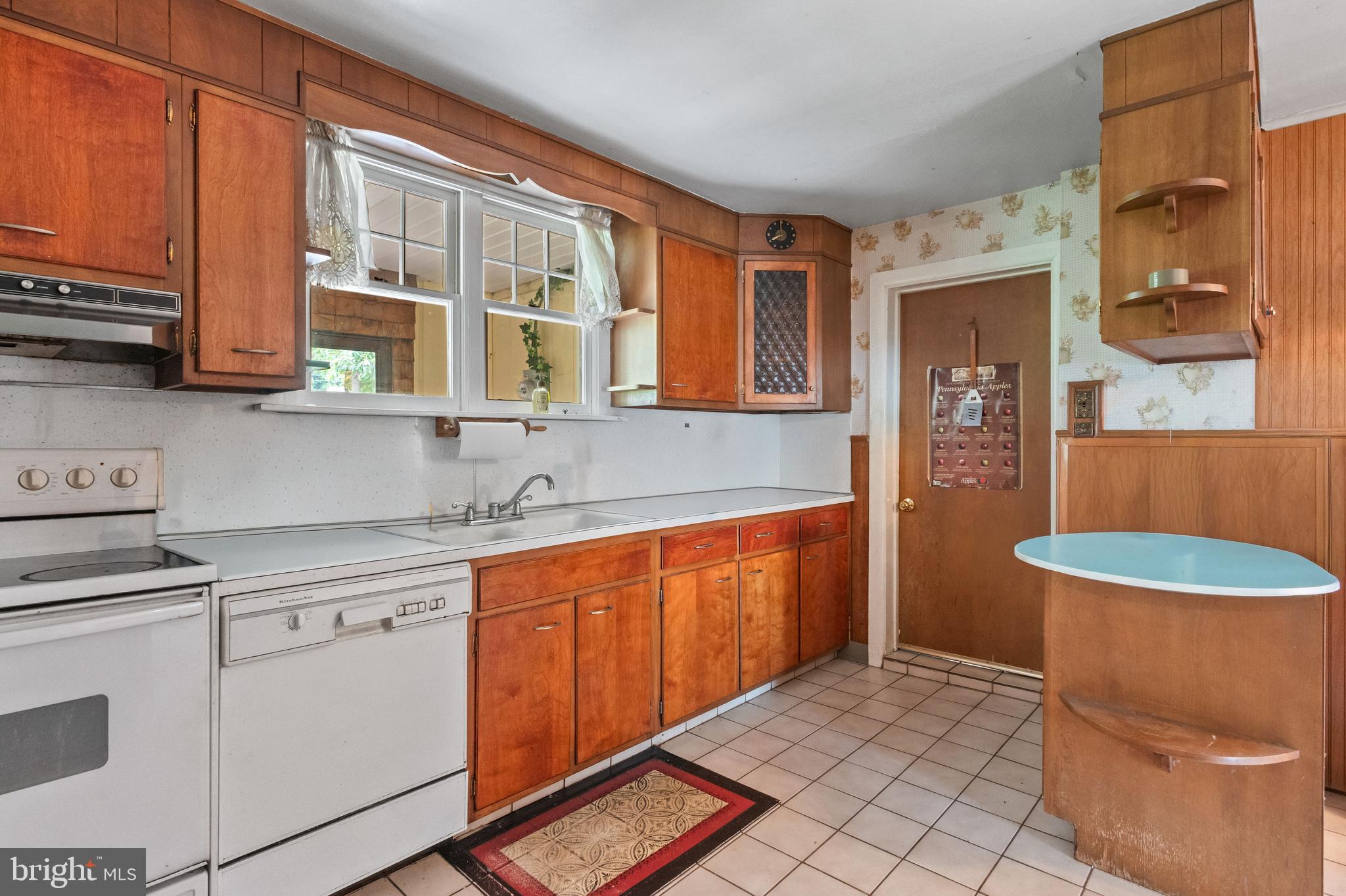 564 Blandon Road Fleetwood, PA 19522 - Photo 18 of 45 a kitchen with stainless steel appliances granite countertop a sink stove and cabinets