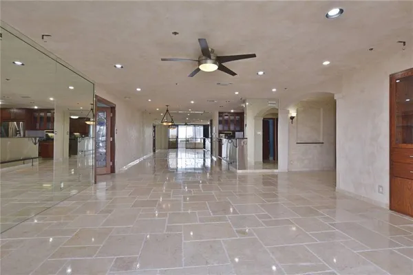 a kitchen with stainless steel appliances granite countertop a sink a stove and a refrigerator