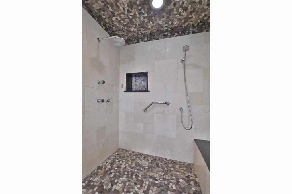 40 North Interstate Highway 35, Unit 12C2 Austin, TX 78701 - Photo 12 of 21 Bathroom with a tile shower