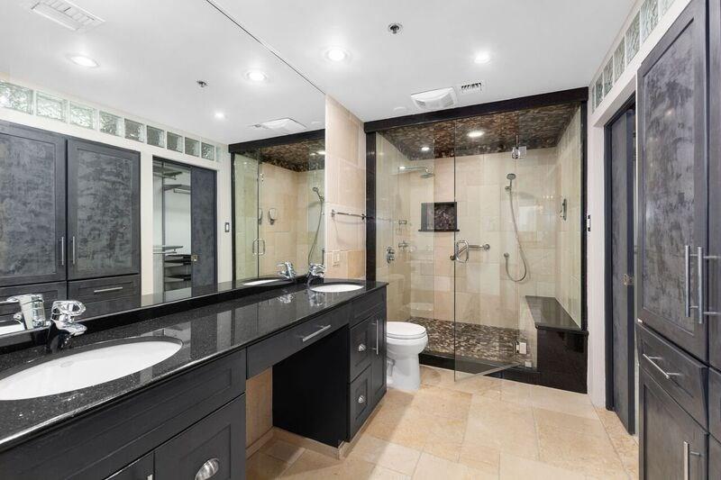 40 North Interstate Highway 35, Unit 12C2 Austin, TX 78701 - Photo 17 of 21 Full bathroom with double vanity, a stall shower, a closet, and recessed lighting