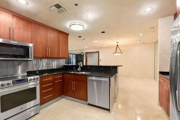 a bathroom with a double vanity sink mirror double and shower