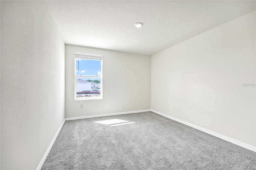 5650 Anders Way St. Cloud, FL 34771 - Photo 12 of 39 an empty room with a window