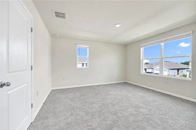 an empty room with windows