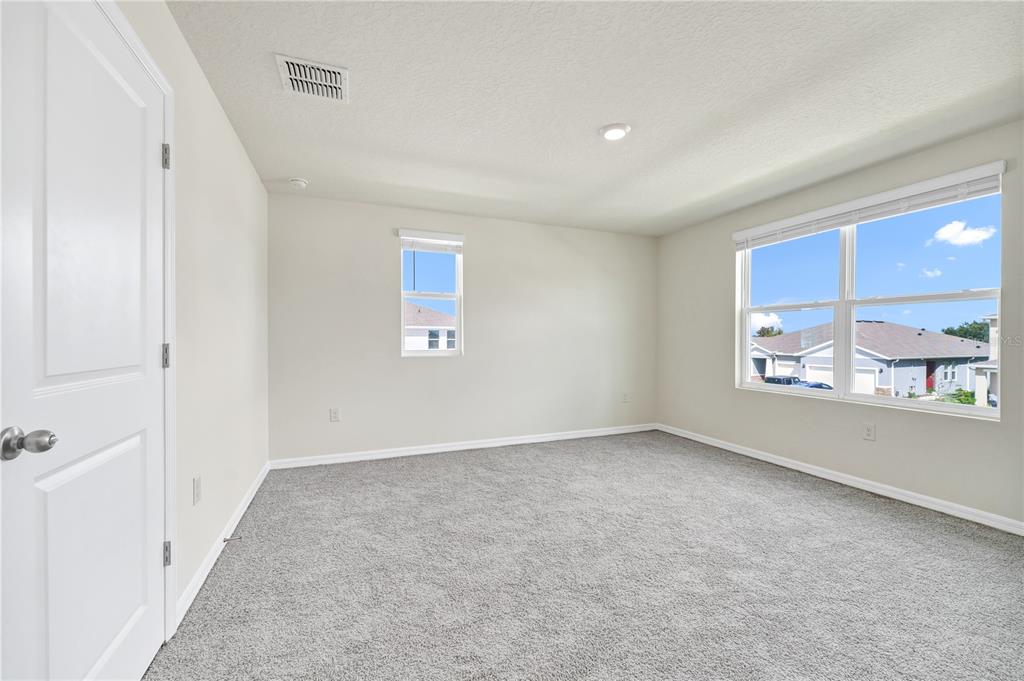 5650 Anders Way St. Cloud, FL 34771 - Photo 19 of 39 an empty room with windows