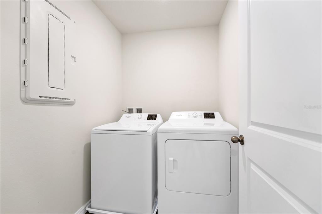 5650 Anders Way St. Cloud, FL 34771 - Photo 21 of 39 a utility room with dryer and washer