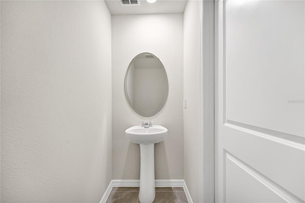 5650 Anders Way St. Cloud, FL 34771 - Photo 24 of 39 a close view of a sink in a bathroom