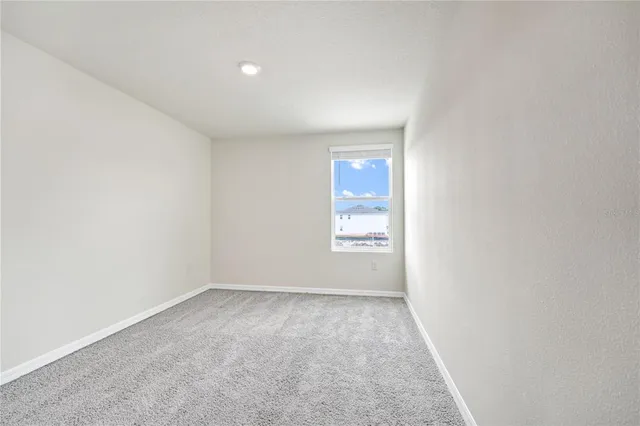 a view of an empty room and window