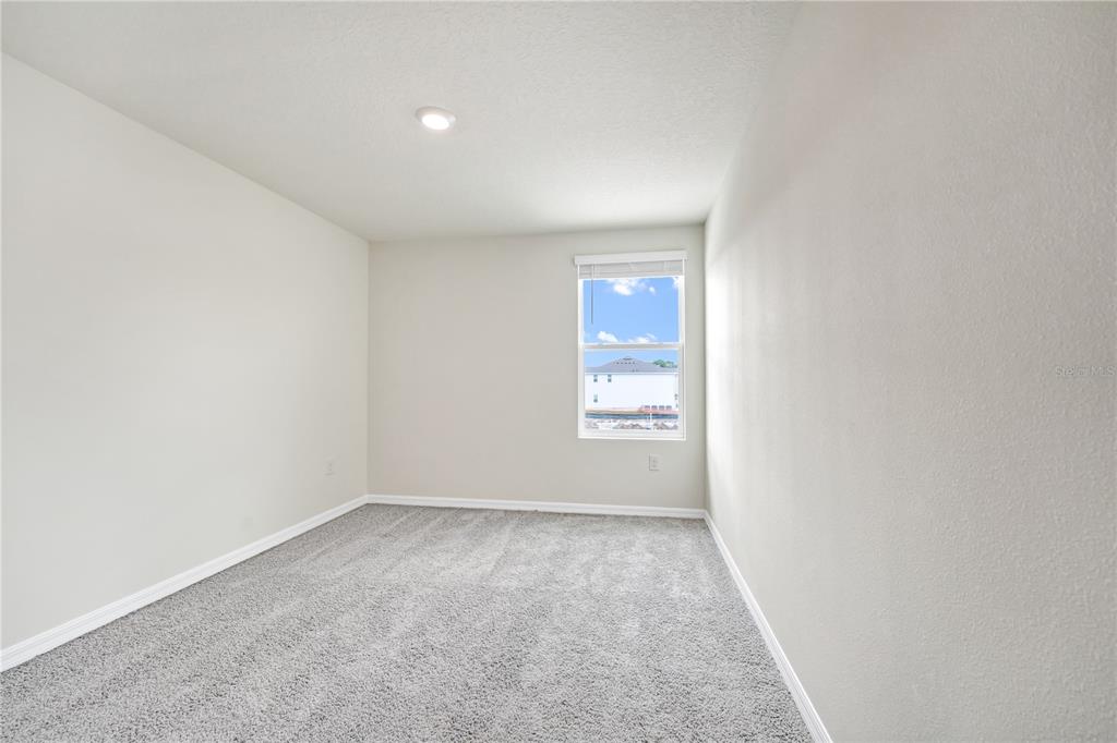 5650 Anders Way St. Cloud, FL 34771 - Photo 30 of 39 a view of an empty room and window