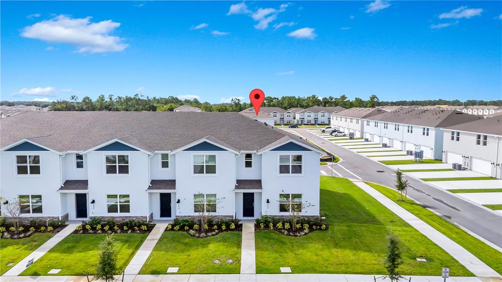 5650 Anders Way St. Cloud, FL 34771 - Photo 37 of 39 a view of a house with pool and a view of a city