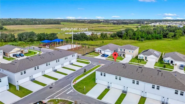 a view of an ocean with seating area and furniture