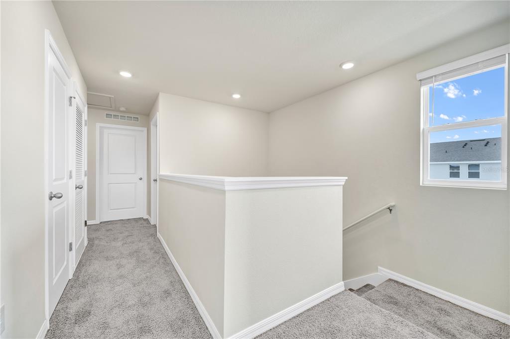 5650 Anders Way St. Cloud, FL 34771 - Photo 6 of 39 a view of hallway